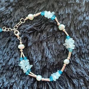 Sterling Silver bracelet with aqua freshwater pearls and stones.